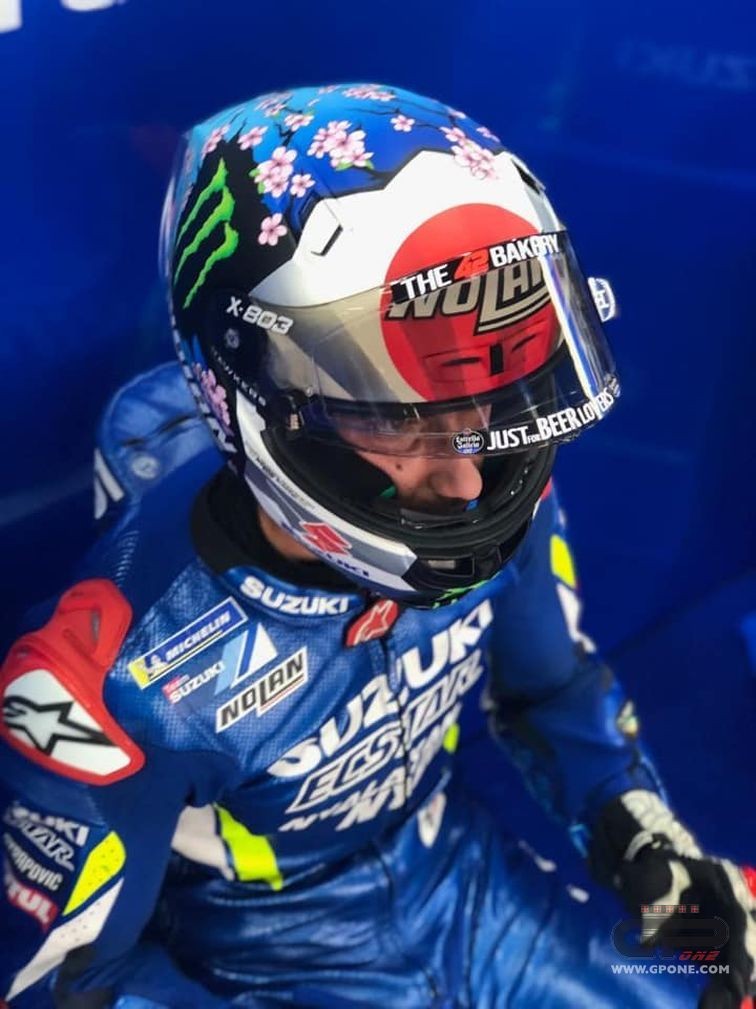 MotoGP Alex Rins on the track in Motegi with a cherry blossom